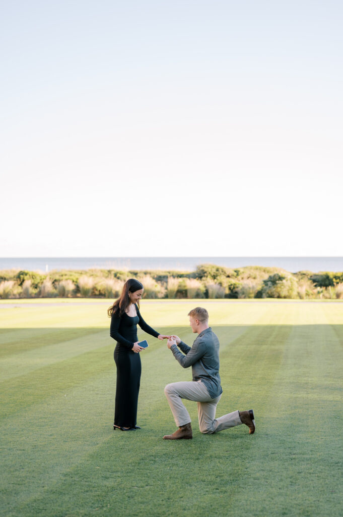 man proposes on The Great Lawn at The Sanctuary