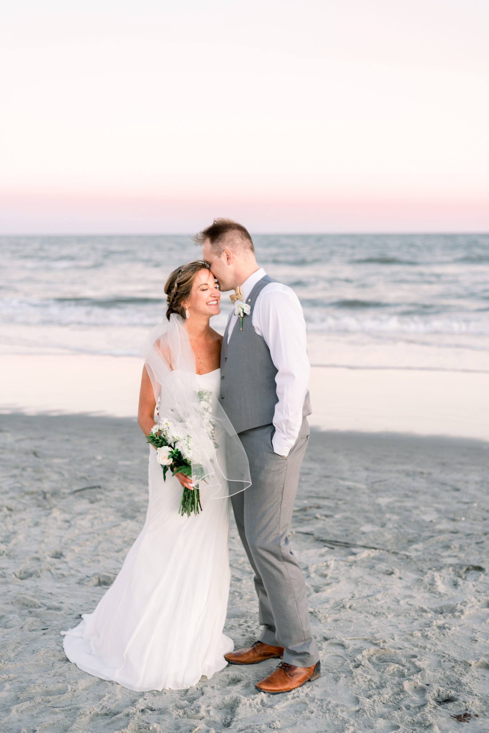 Bride and groom on the beach in Charleston, SC