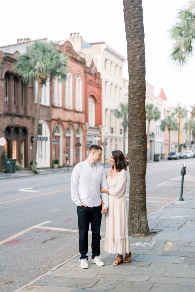 Couple standing together on Broad Street in Charleston South Carolina