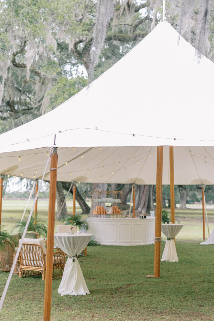 Sailcloth tent with reception setup at Middleton Place
