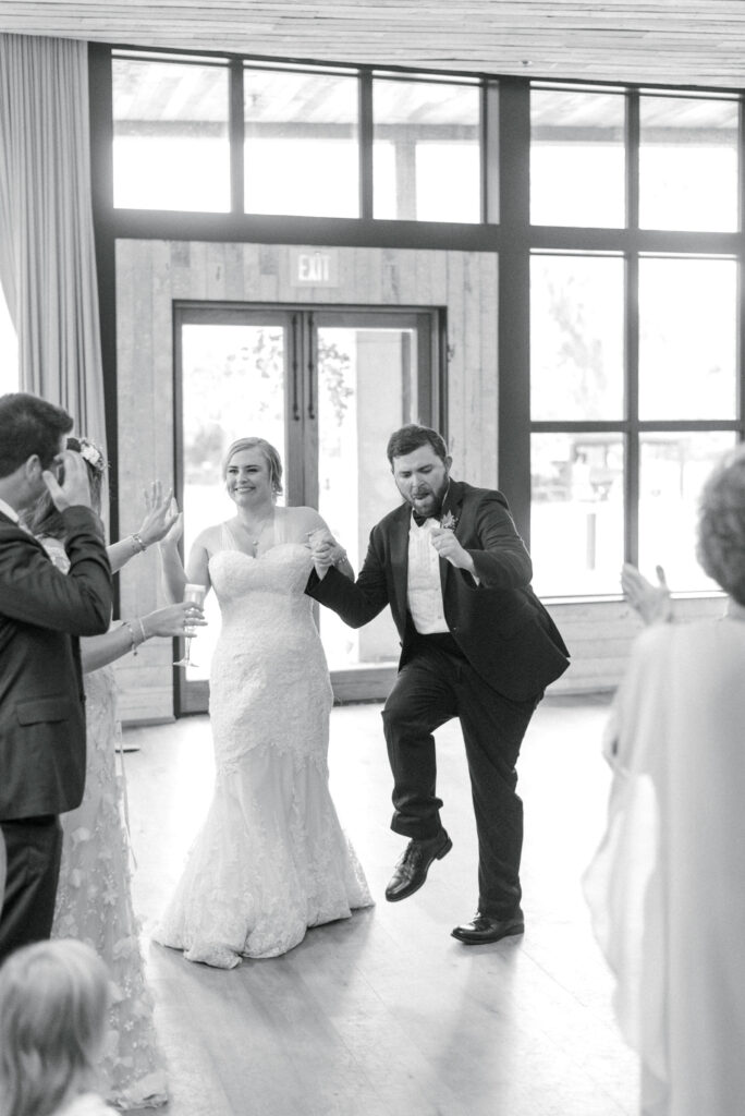 Bride and groom dance as they enter their reception at middleton Place