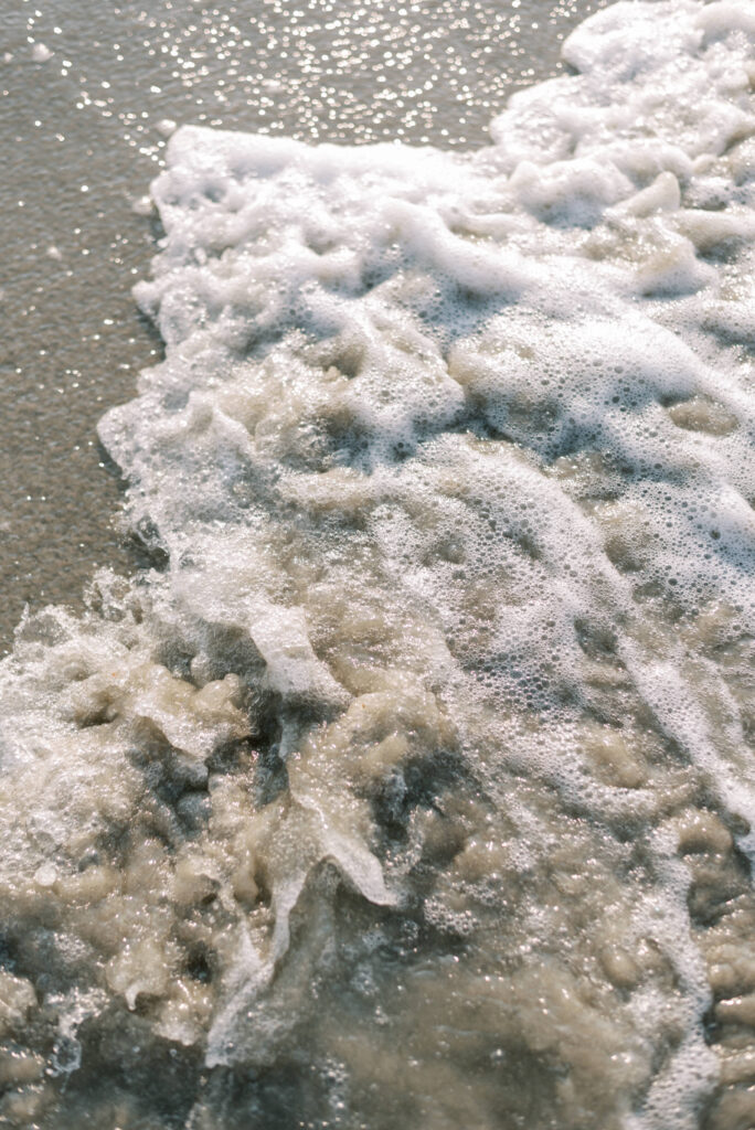 Bubble wash of ocean waves on the beach at Folly Beach