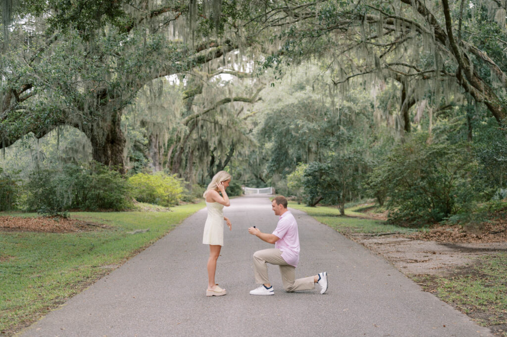 Man proposing to his girlfriend during a surprise proposal in Charleston