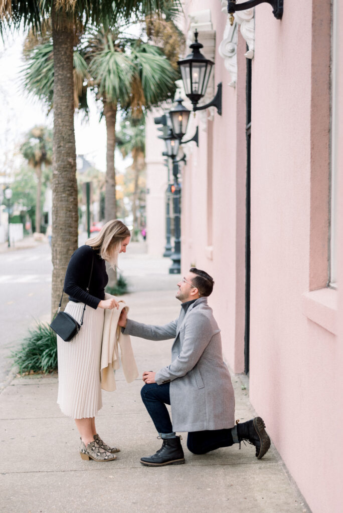 Man surprising his girlfriend with a romantic proposal in Charleston